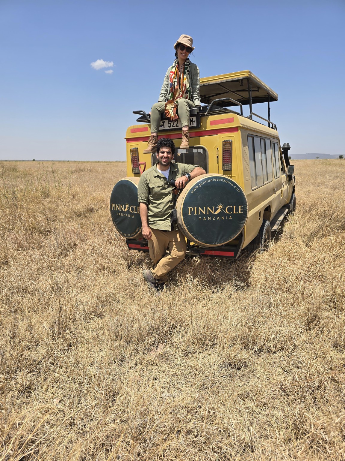 Honeymoon couple with their private Pinnacle safari vehicle